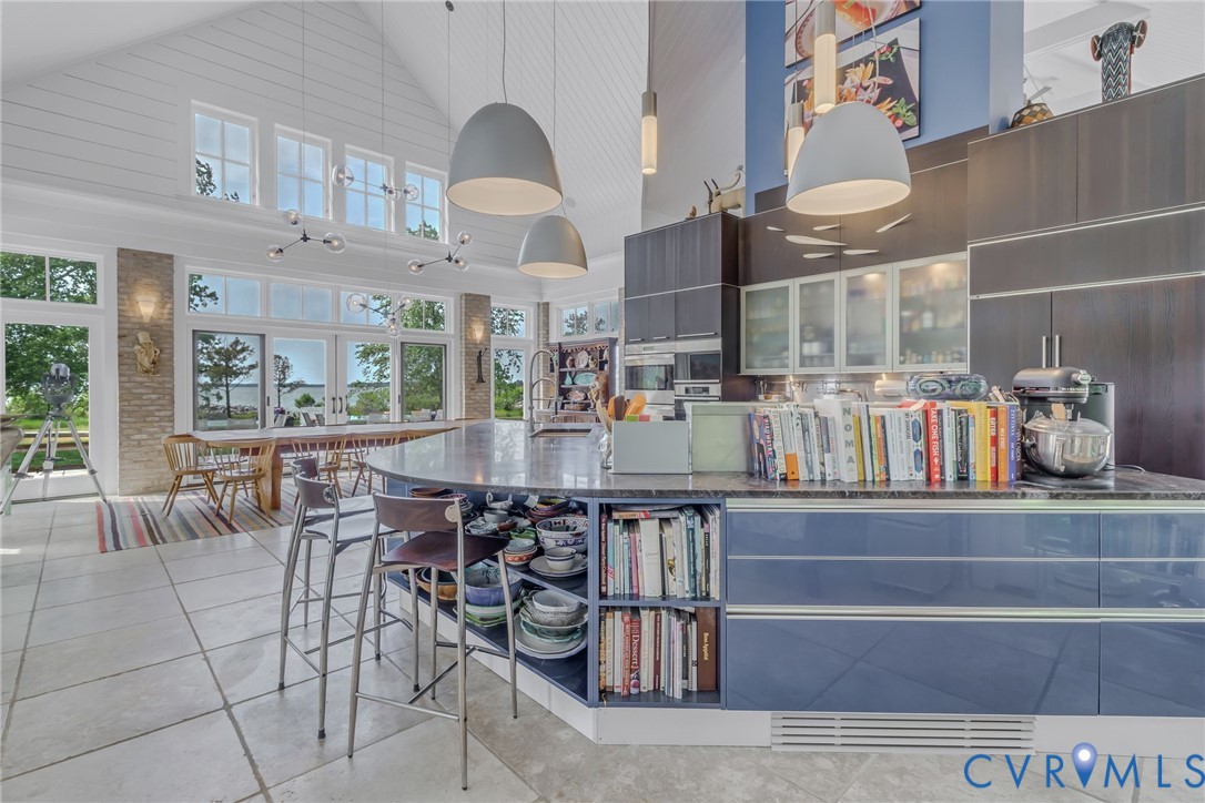 1071 Gum Thicket Road Gwynn, VA 23076 - Photo 21 of 53 a kitchen with stainless steel appliances granite countertop a table chairs and a view of living room