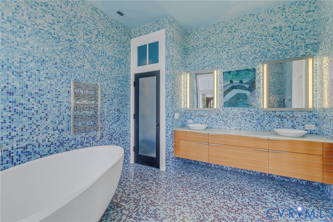 1071 Gum Thicket Road Gwynn, VA 23076 - Photo 27 of 53 a bathroom with a bathtub and a sink