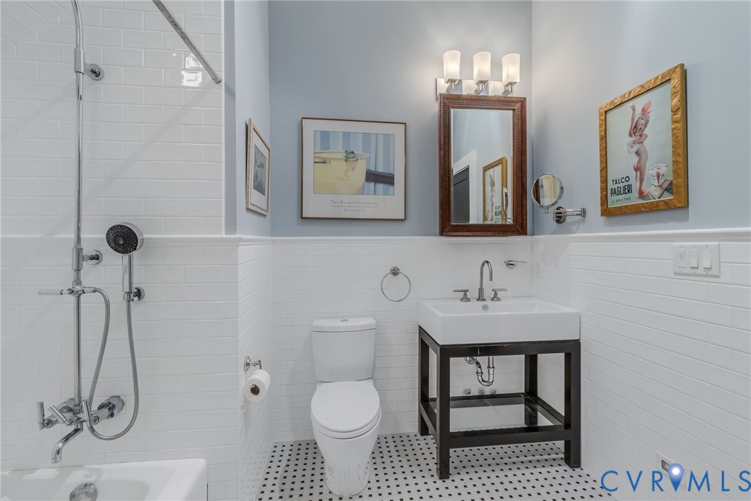 1071 Gum Thicket Road Gwynn, VA 23076 - Photo 34 of 53 a bathroom with a sink toilet and mirror