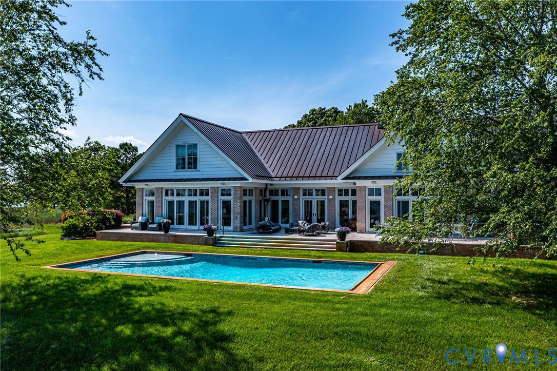 1071 Gum Thicket Road Gwynn, VA 23076 - Photo 49 of 53 a front view of house with yard and swimming pool