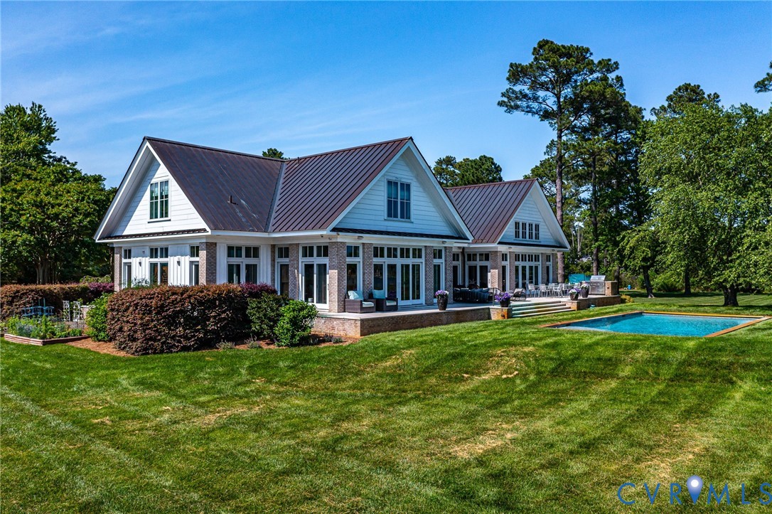 1071 Gum Thicket Road Gwynn, VA 23076 - Photo 6 of 53 a front view of a house with a garden