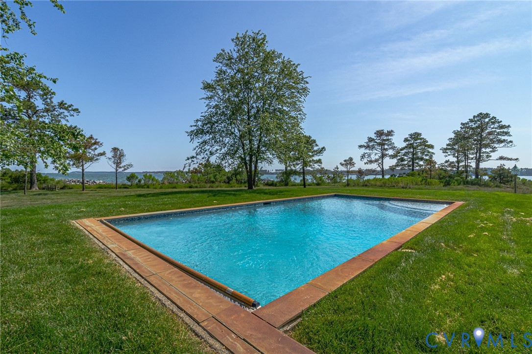 1071 Gum Thicket Road Gwynn, VA 23076 - Photo 7 of 53 a view of a backyard with a small pool and trees