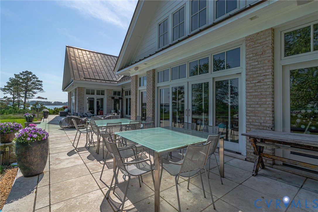 1071 Gum Thicket Road Gwynn, VA 23076 - Photo 8 of 53 a view of a patio with table and chairs and potted plants