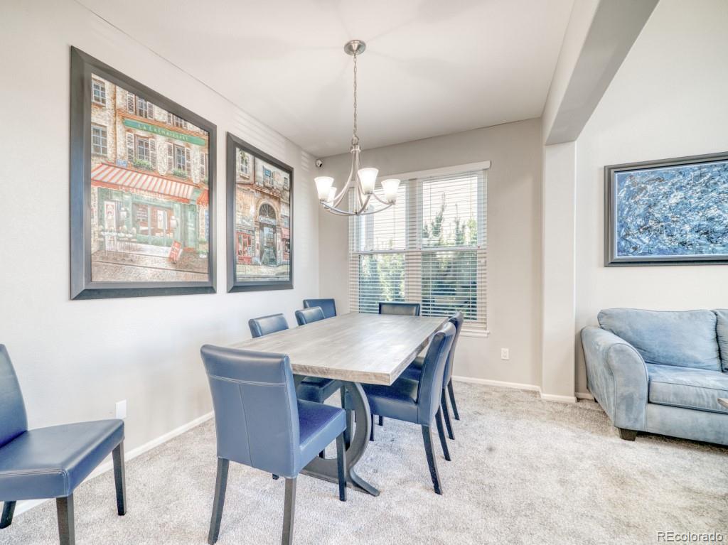 1864 Mountain Maple Avenue Highlands Ranch, CO 80129 - Photo 11 of 35 a view of a dining room with furniture window and outside view