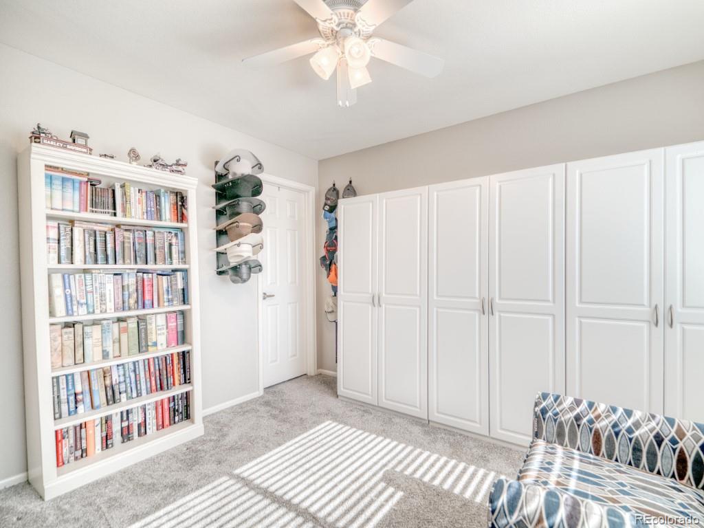 1864 Mountain Maple Avenue Highlands Ranch, CO 80129 - Photo 17 of 35 a view of a bedroom with furniture and staircase