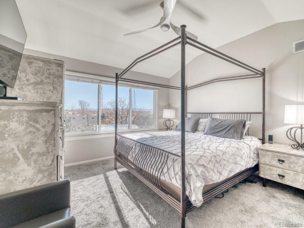1864 Mountain Maple Avenue Highlands Ranch, CO 80129 - Photo 18 of 35 a bed sitting in a bedroom next to a window