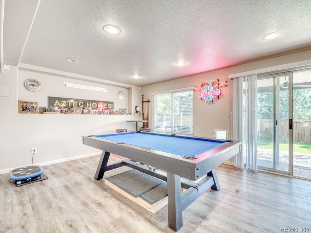 1864 Mountain Maple Avenue Highlands Ranch, CO 80129 - Photo 28 of 35 a room with furniture pool table and windows