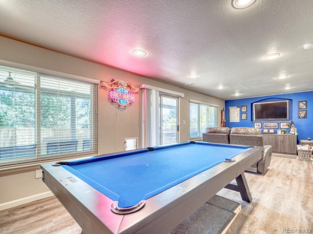 1864 Mountain Maple Avenue Highlands Ranch, CO 80129 - Photo 29 of 35 a room with pool table and windows
