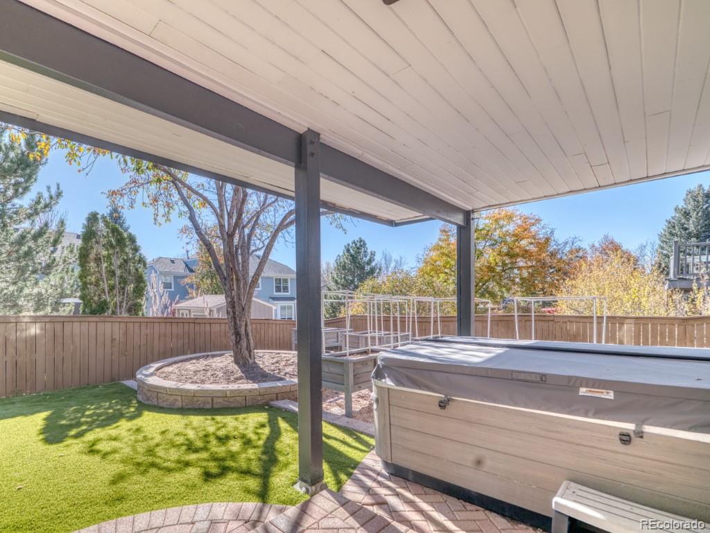1864 Mountain Maple Avenue Highlands Ranch, CO 80129 - Photo 3 of 35 a view of a porch with furniture and garden