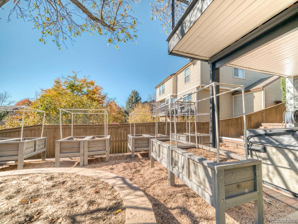 1864 Mountain Maple Avenue Highlands Ranch, CO 80129 - Photo 31 of 35 a building outdoor space with patio furniture and potted plants