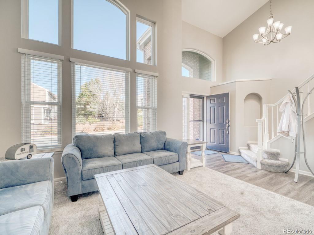 1864 Mountain Maple Avenue Highlands Ranch, CO 80129 - Photo 5 of 35 a living room with furniture and a large window