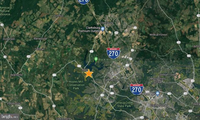 14890 Clopper Road Boyds, MD 20841 - Photo 3 of 15 a sign that is sitting in a tree