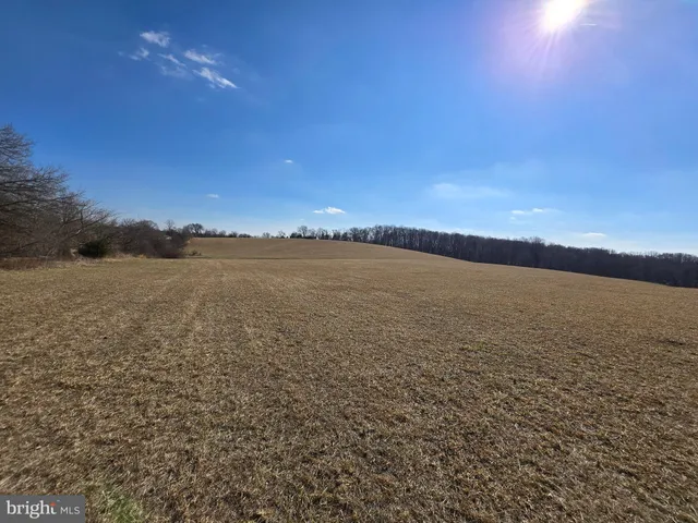 a view of an ocean beach and mountain