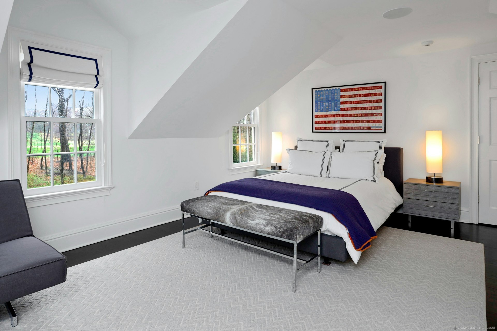 75 Hanson Road Darien, CT 06820 - Photo 24 of 30 a spacious bedroom with a bed and a couch