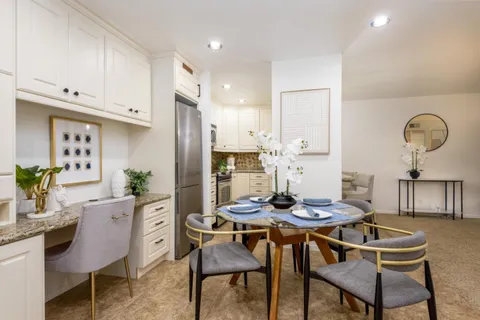 a view of a dining room with furniture