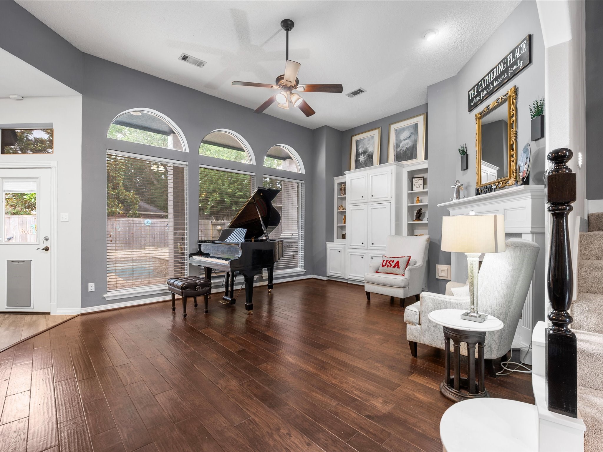 5910 Center Ct Drive Spring, TX 77379 - Photo 12 of 50 High ceilings enhance the sense of scale while large windows and classic built-ins provide refined storage and a seamless connection to the beautifully landscaped backyard.
