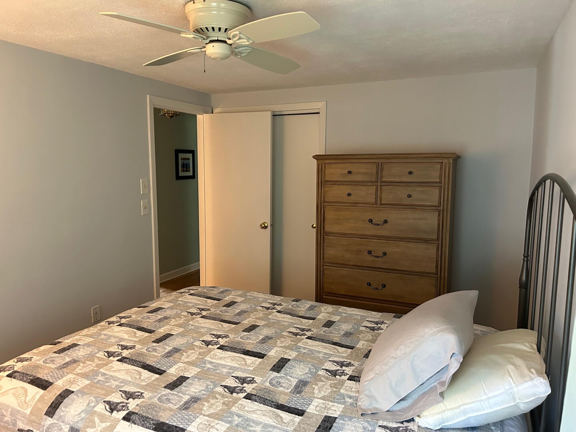 5 Acorn Road Dennis, MA 02638 - Photo 11 of 27 a bedroom with a bed and a dresser