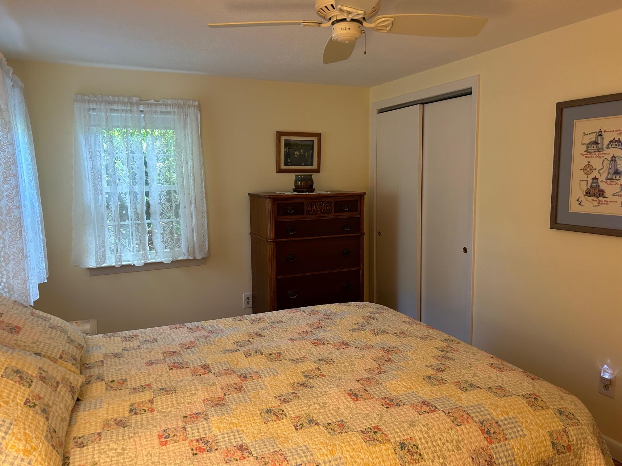 5 Acorn Road Dennis, MA 02638 - Photo 13 of 27 a bedroom with a bed and a dresser