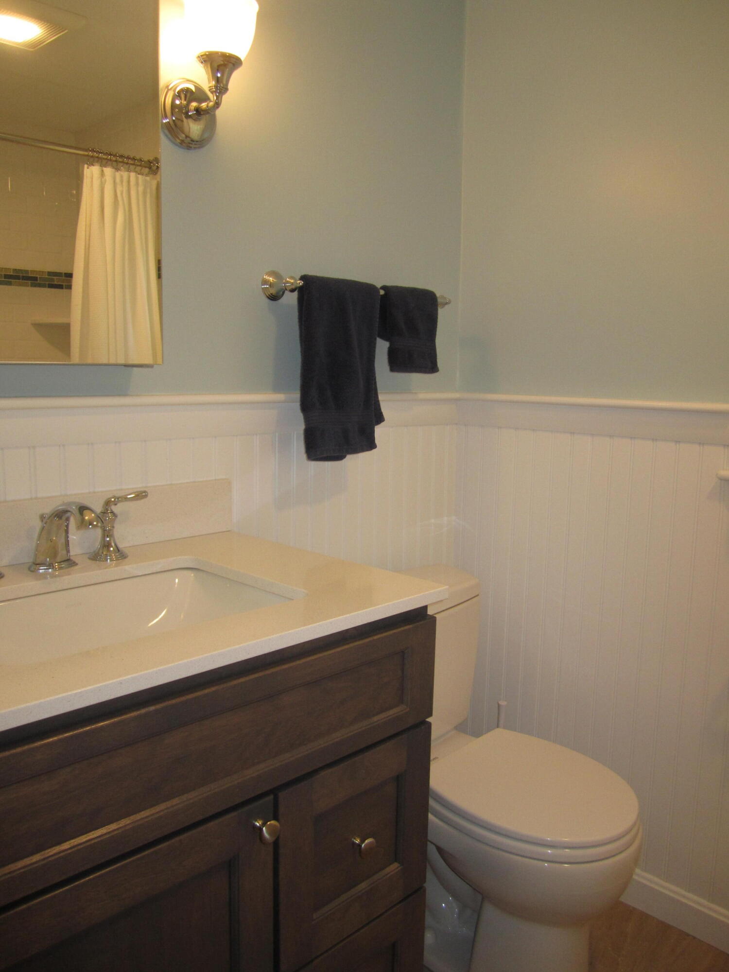 5 Acorn Road Dennis, MA 02638 - Photo 17 of 27 a bathroom with a sink a toilet and mirror