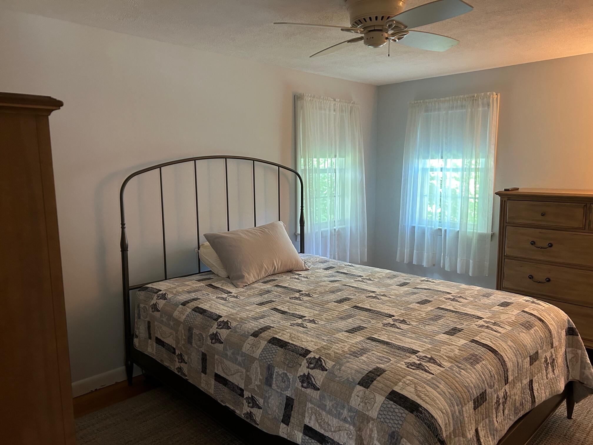 5 Acorn Road Dennis, MA 02638 - Photo 10 of 27 a bedroom with a bed and a mirror