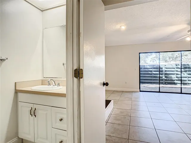 a bathroom with a sink a vanity and a mirror