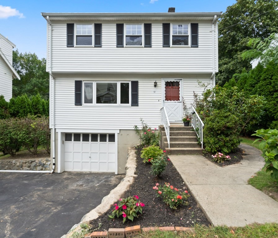 12 Lansdowne Road Arlington, MA 02474 - Photo 1 of 26 a front view of a house with a yard