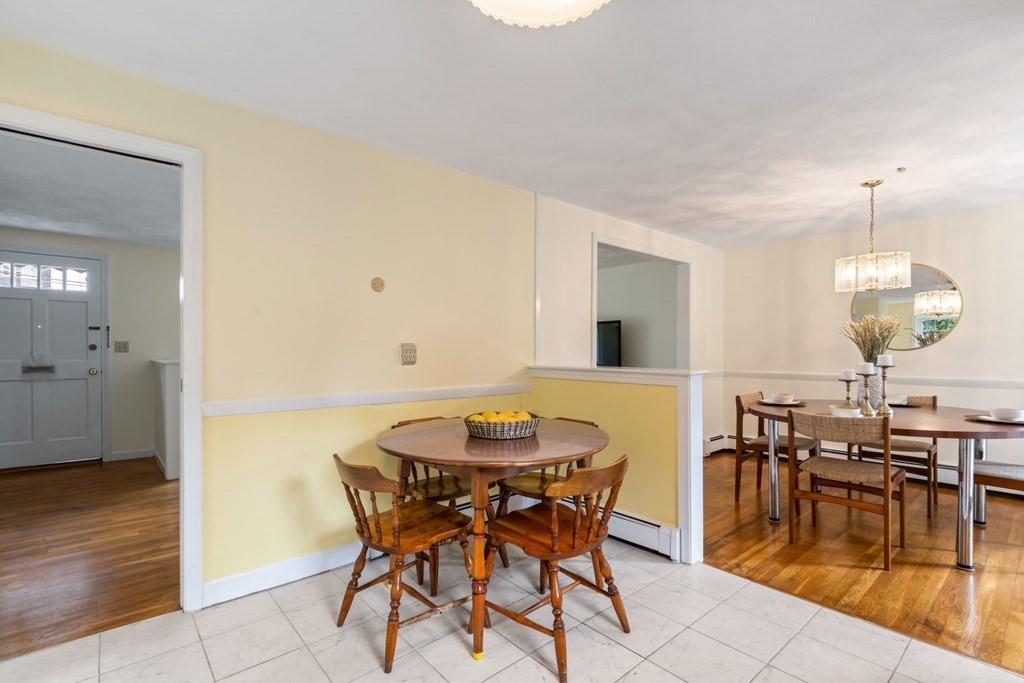 12 Lansdowne Road Arlington, MA 02474 - Photo 11 of 26 a dining room with furniture and wooden floor