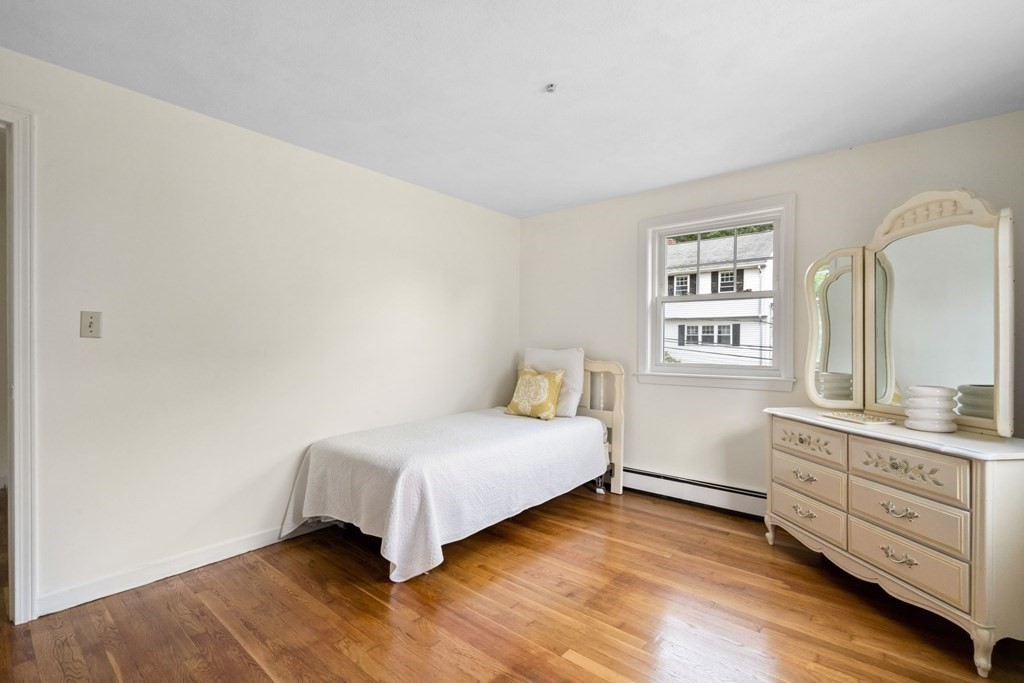 12 Lansdowne Road Arlington, MA 02474 - Photo 19 of 26 a bedroom with a bed and a window