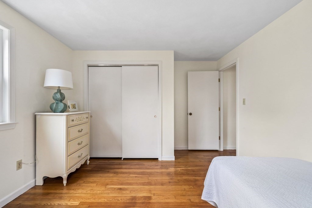 12 Lansdowne Road Arlington, MA 02474 - Photo 21 of 26 a bedroom with a bed and a dresser