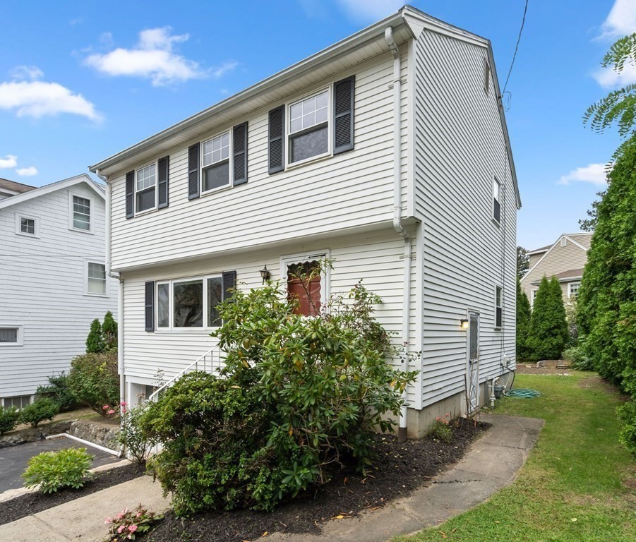 12 Lansdowne Road Arlington, MA 02474 - Photo 26 of 26 a front view of a house with garden