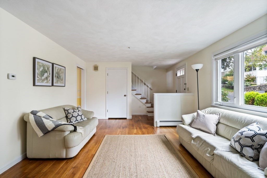 12 Lansdowne Road Arlington, MA 02474 - Photo 3 of 26 a living room with furniture and a large window