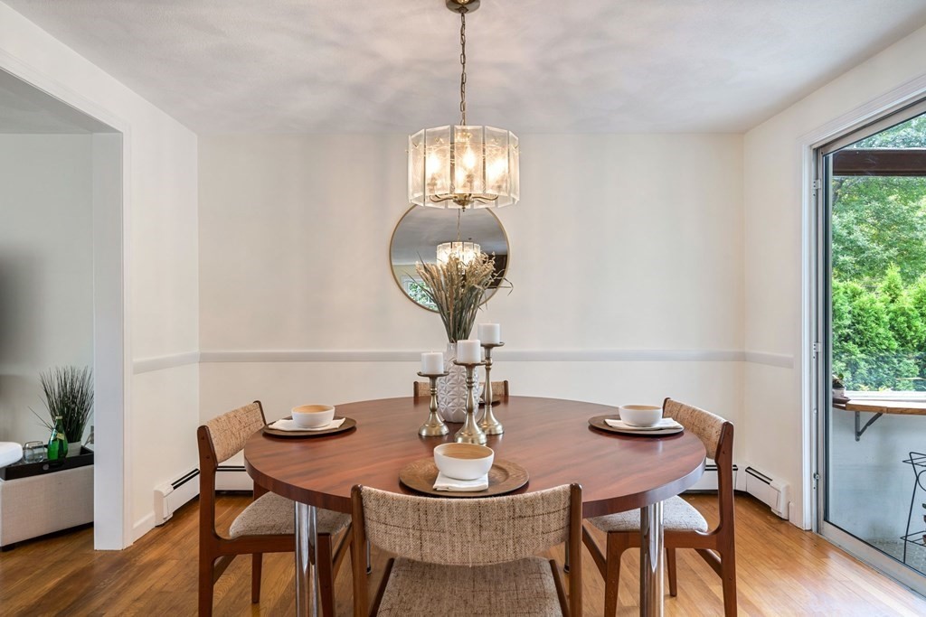 12 Lansdowne Road Arlington, MA 02474 - Photo 6 of 26 a view of a dining room with furniture wooden floor and chandelier