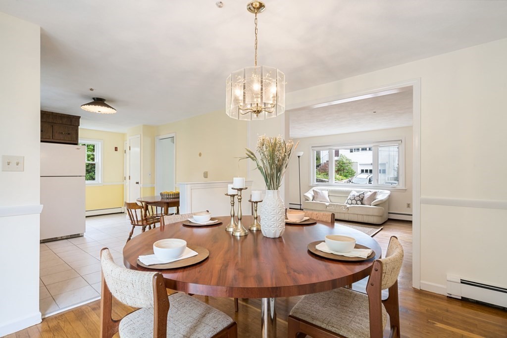 12 Lansdowne Road Arlington, MA 02474 - Photo 7 of 26 a view of a dining room with furniture and wooden floor