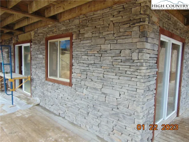 a brick building with a door and a window
