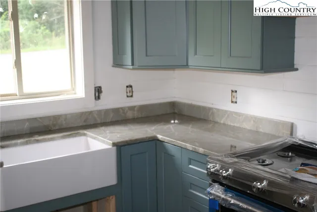 a kitchen with a sink and cabinets