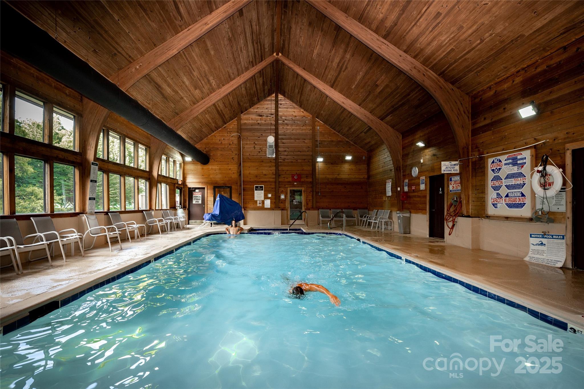 Lot 32 High Rock Ridge Lake Lure, NC 28746 - Photo 20 of 23 a swimming pool with outdoor seating and yard