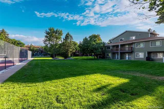 a view of house with a big yard