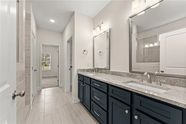 a bathroom with a double vanity sink and mirror