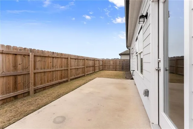 an aerial view of a house with a swimming pool and outdoor seating