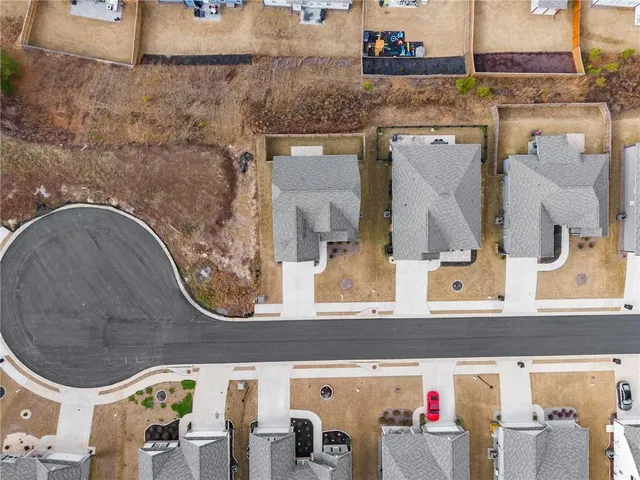 an aerial view of a house with a swimming pool