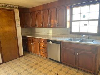2500 Chestnut Street Amarillo, TX 79107 - Photo 15 of 20 a kitchen with a sink window and cabinets
