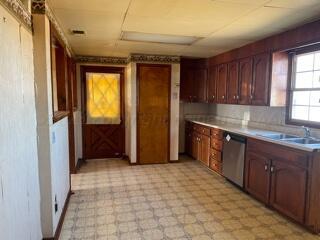 2500 Chestnut Street Amarillo, TX 79107 - Photo 18 of 20 a kitchen with stainless steel appliances granite countertop a refrigerator and a sink