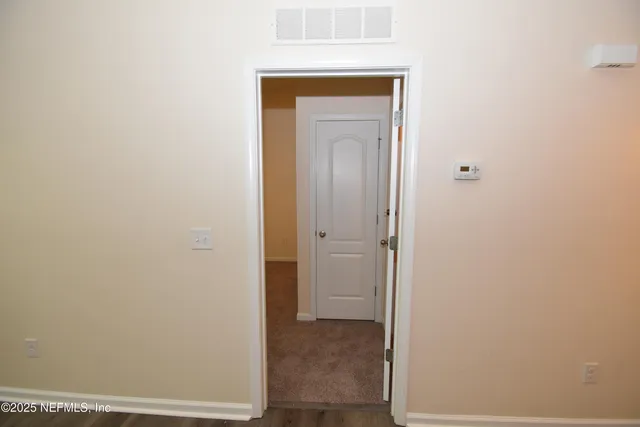 a view of a bathroom with mirror