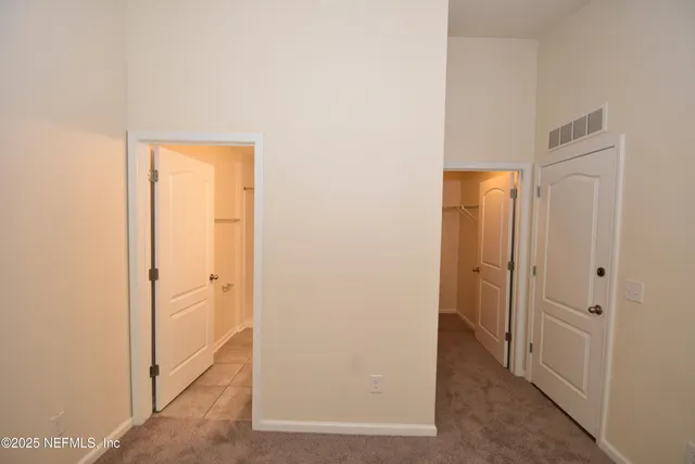 a view of a hallway with closet