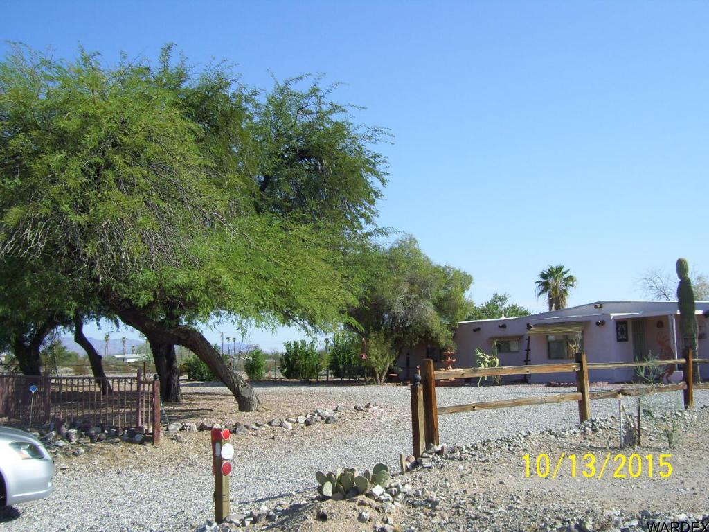 7185 Chocco Road Big River, CA 92242 - Photo 1 of 13 a front view of a house with garden