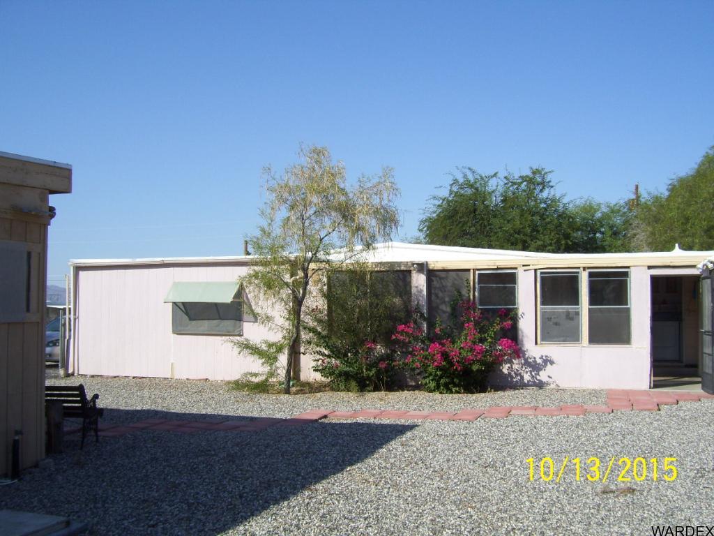 7185 Chocco Road Big River, CA 92242 - Photo 12 of 13 a front view of a house with a garden