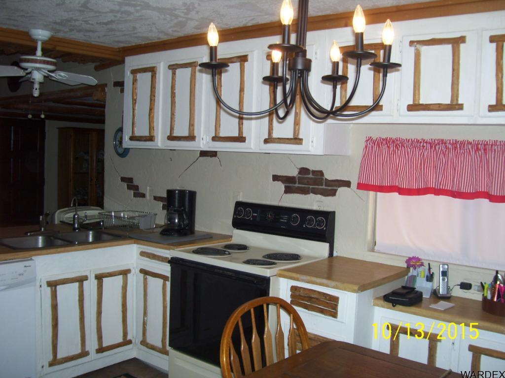 7185 Chocco Road Big River, CA 92242 - Photo 2 of 13 a kitchen with stainless steel appliances granite countertop a stove and a sink