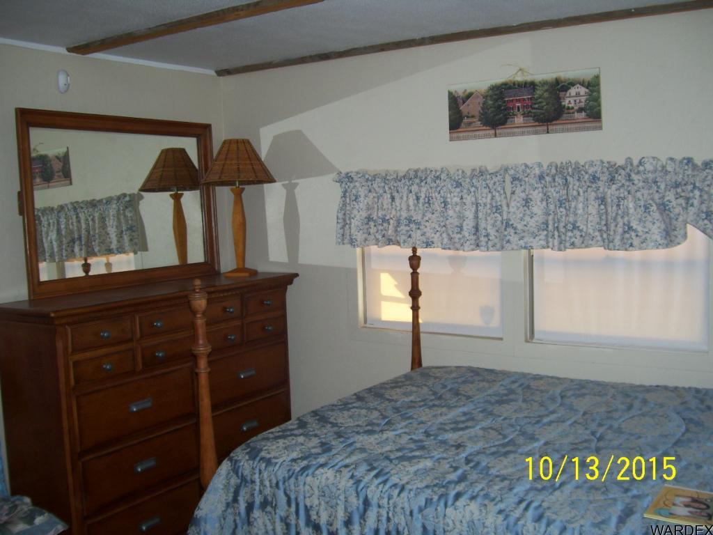 7185 Chocco Road Big River, CA 92242 - Photo 8 of 13 a bedroom with a bed and a dresser in it