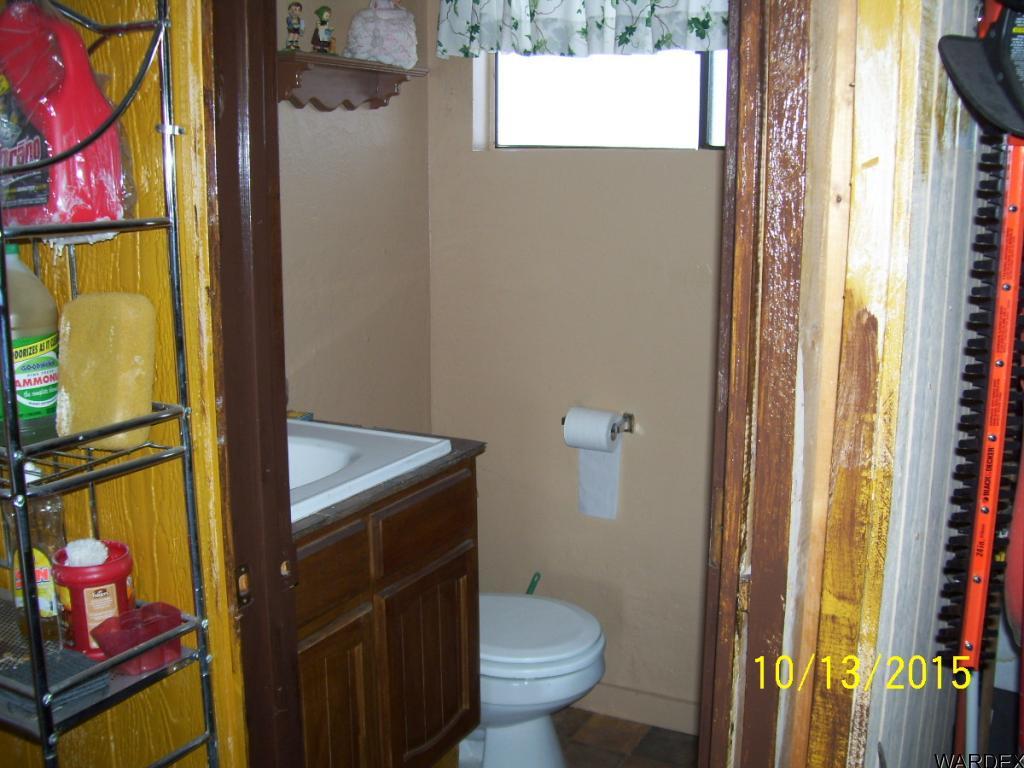 7185 Chocco Road Big River, CA 92242 - Photo 10 of 13 a bathroom with a toilet and a shower curtain