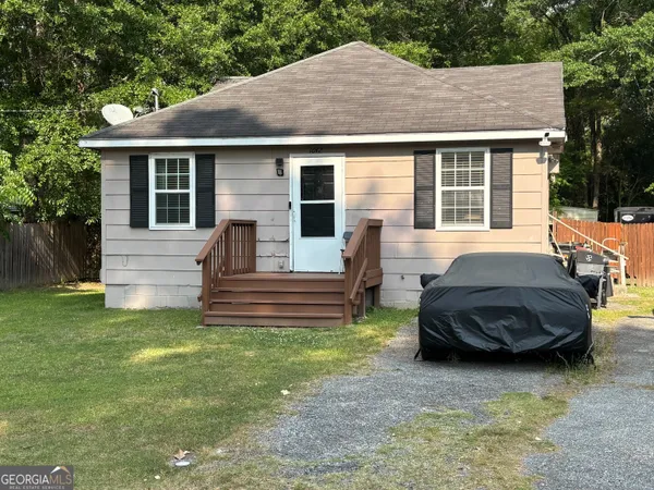 a front view of a house with a yard